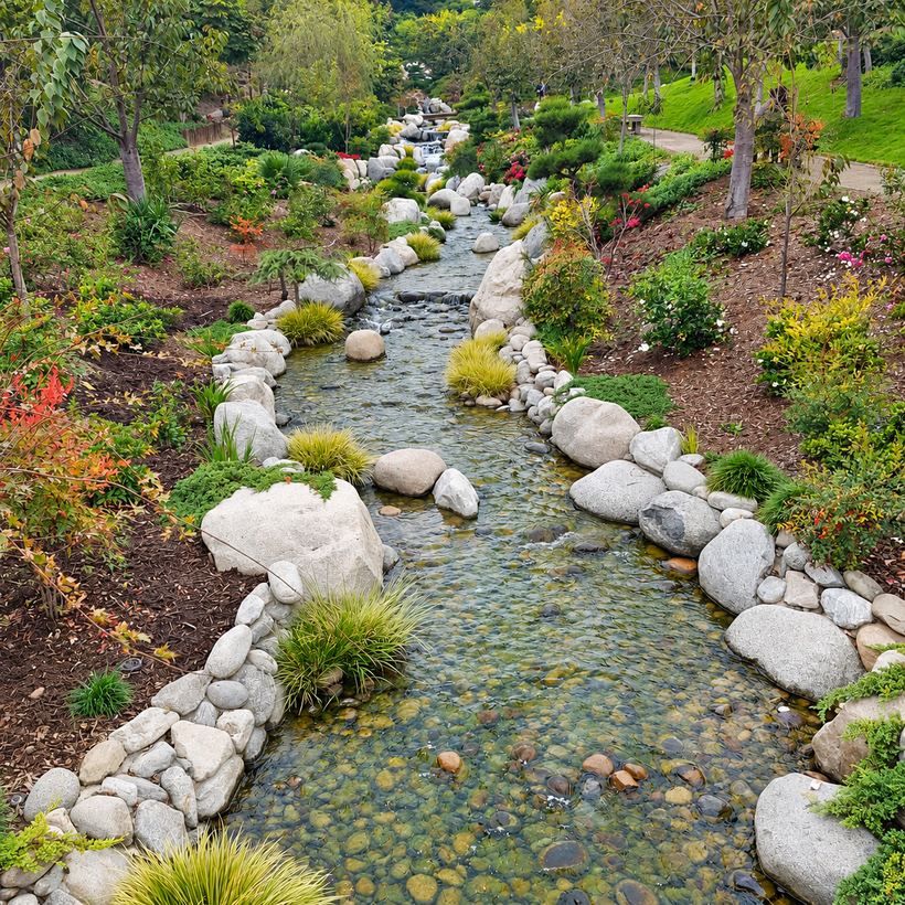 A stream winding through a public garden