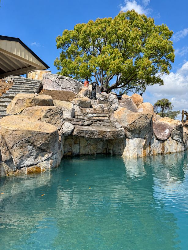 Rock steps above a grotto at the water's edge