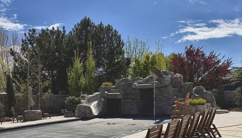 Rock grotto and slide at the end of the pool